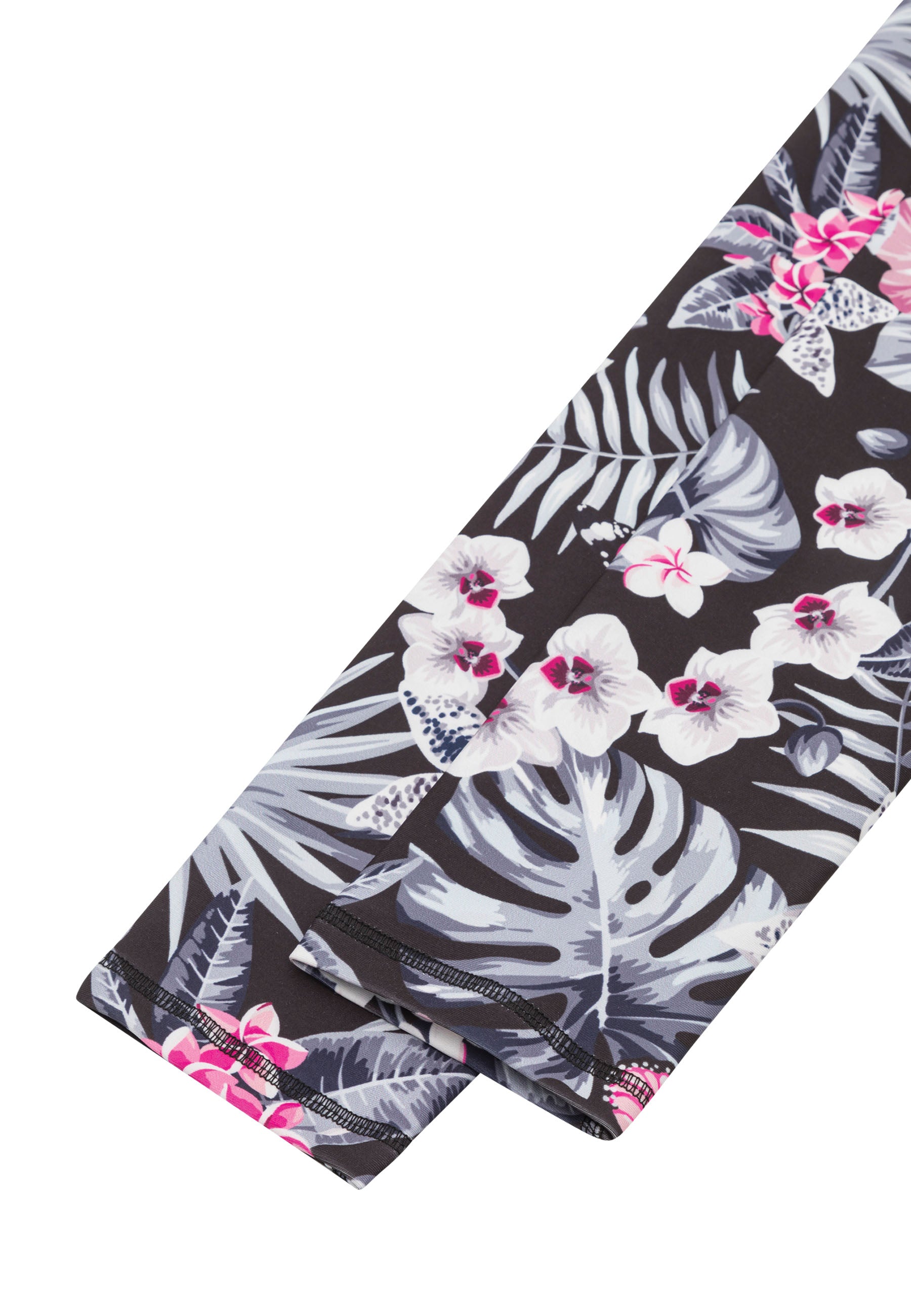 Die 890 Extra High Waist Leggings von Lismina sind schwarz mit weißem und rosa Blumenmuster, ordentlich gefaltet – ein echter Hingucker.